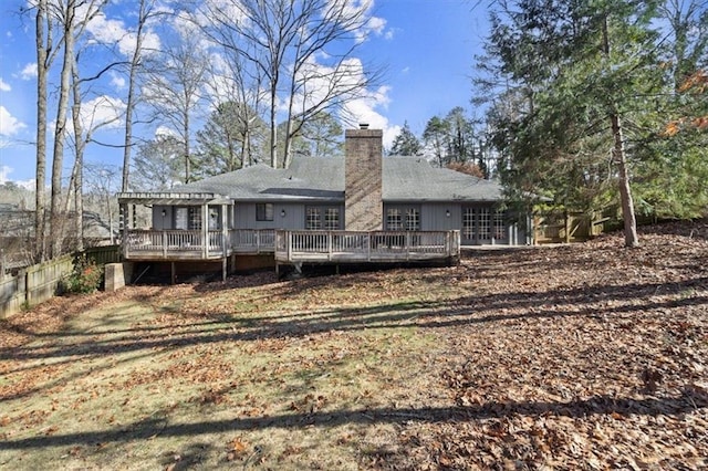 back of house featuring a pergola and a wooden deck