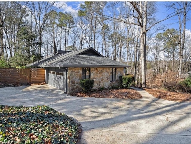 view of side of home with a garage