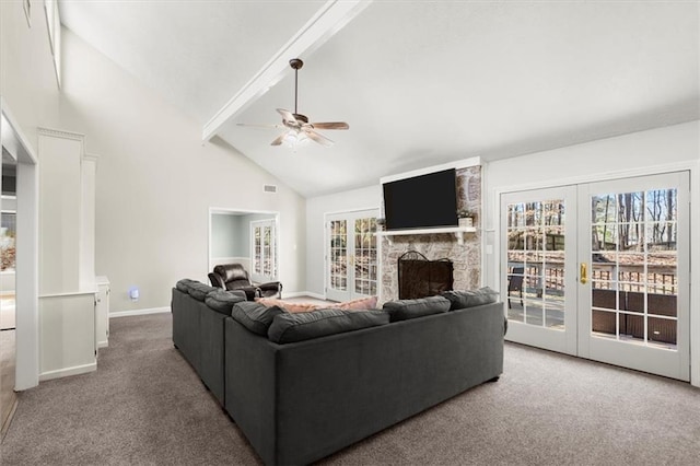 carpeted living room with french doors, high vaulted ceiling, ceiling fan, beamed ceiling, and a stone fireplace