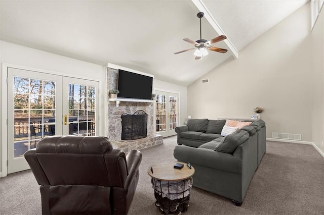 carpeted living room with french doors, high vaulted ceiling, a fireplace, and ceiling fan