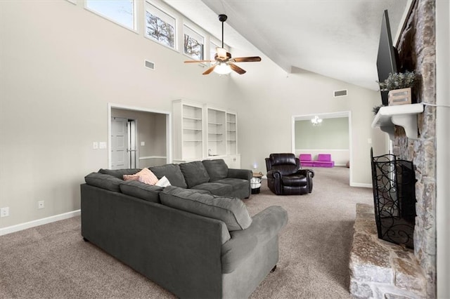 living room with a stone fireplace, ceiling fan, high vaulted ceiling, carpet flooring, and beam ceiling