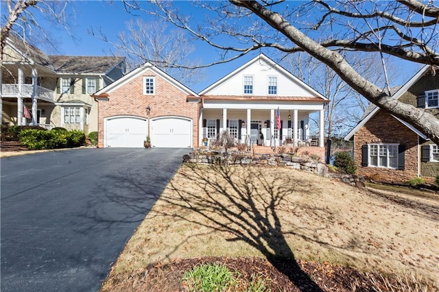 view of front of house with a porch and a garage