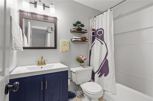 bathroom featuring vanity, toilet, and shower / bath combo