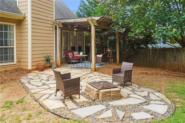 view of patio / terrace featuring a pergola, an outdoor fire pit, and fence