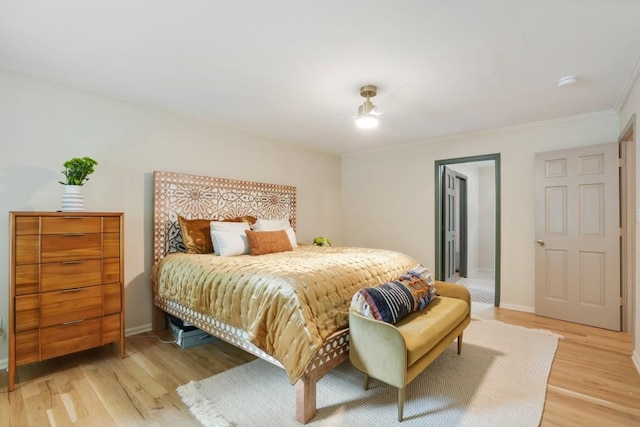 bedroom with ceiling fan, baseboards, light wood-type flooring, and ornamental molding