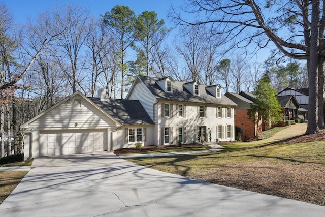 view of front of house with a front yard, an attached garage, brick siding, and concrete driveway