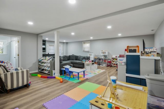 rec room featuring recessed lighting, wood finished floors, and baseboards