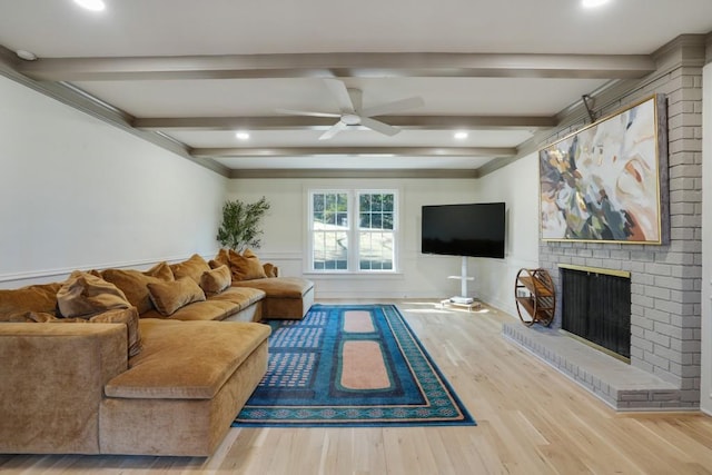 living room with wood finished floors, a ceiling fan, a fireplace, recessed lighting, and beamed ceiling