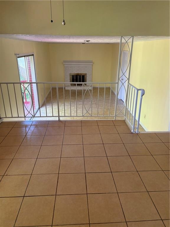 801 Needle Rock Dr, Stone Mountain, GA 30083 - tiled empty room featuring a fireplace