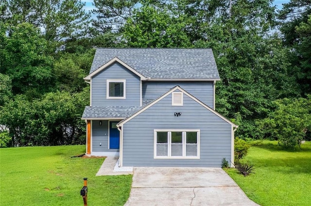 597 Woodcrest Manor Dr, Stone Mountain, GA 30083 - traditional home featuring a front lawn, roof with shingles, and concrete driveway