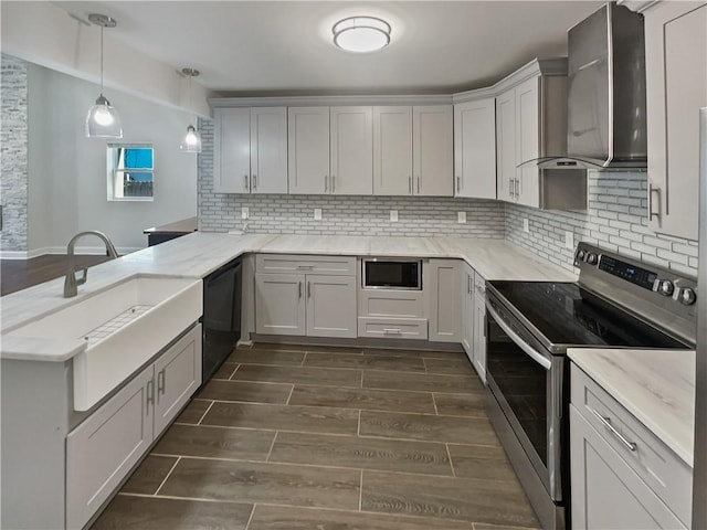 kitchen with wood finish floors, black dishwasher, electric stove, built in microwave, and wall chimney exhaust hood