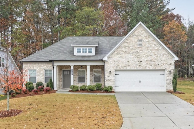 view of front of home featuring a garage and a front yard