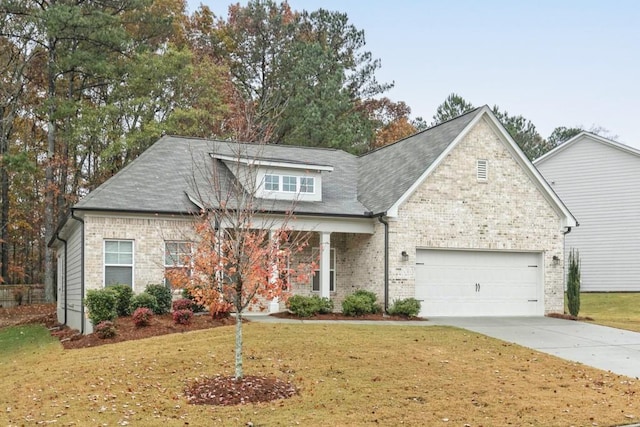 view of front facade with a front yard and a garage