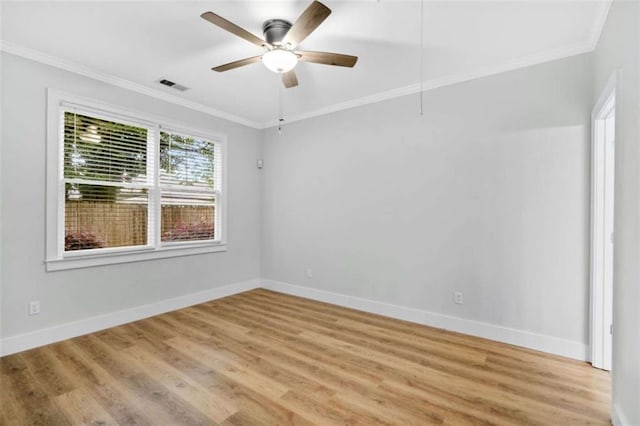 1283 Mercer, East Point, GA 30344 - spare room with ornamental molding, light wood-style flooring, and a ceiling fan