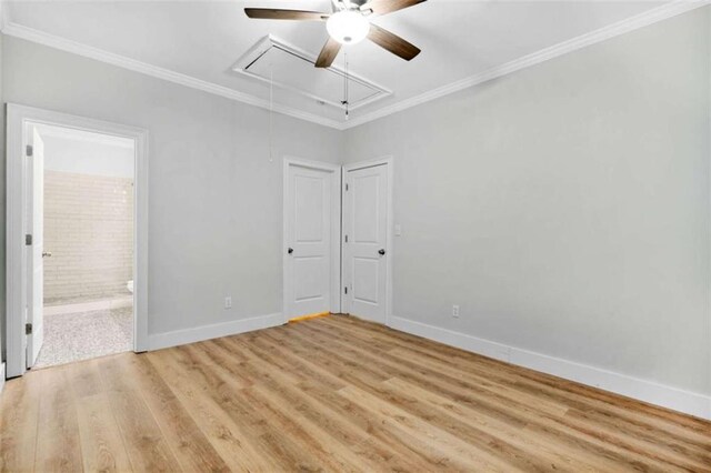1283 Mercer, East Point, GA 30344 - unfurnished bedroom with attic access, light wood-type flooring, ornamental molding, connected bathroom, and ceiling fan