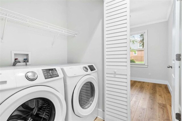 1283 Mercer, East Point, GA 30344 - laundry area with independent washer and dryer, ornamental molding, and light wood-type flooring