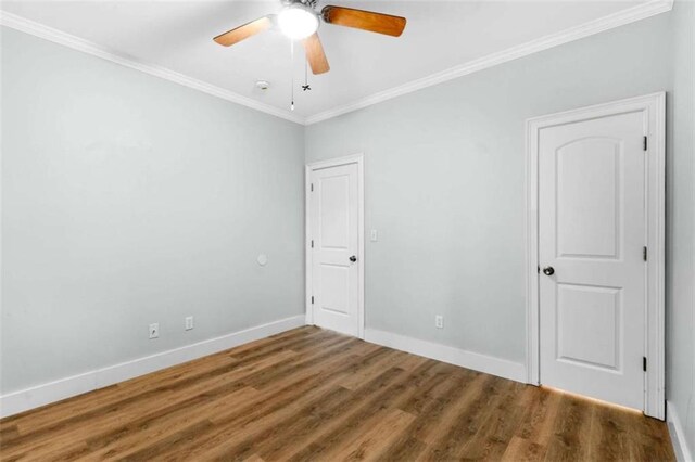 1283 Mercer, East Point, GA 30344 - unfurnished bedroom with ornamental molding, wood finished floors, and a ceiling fan