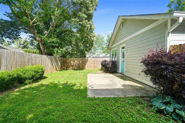 1283 Mercer, East Point, GA 30344 - fenced backyard with a patio area