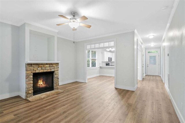 1283 Mercer, East Point, GA 30344 - unfurnished living room with wood finished floors, a fireplace, crown molding, and ceiling fan