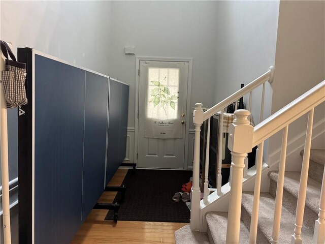 2107 Hailston Dr, Duluth, GA 30097 - foyer featuring stairs, wood finished floors, and a towering ceiling