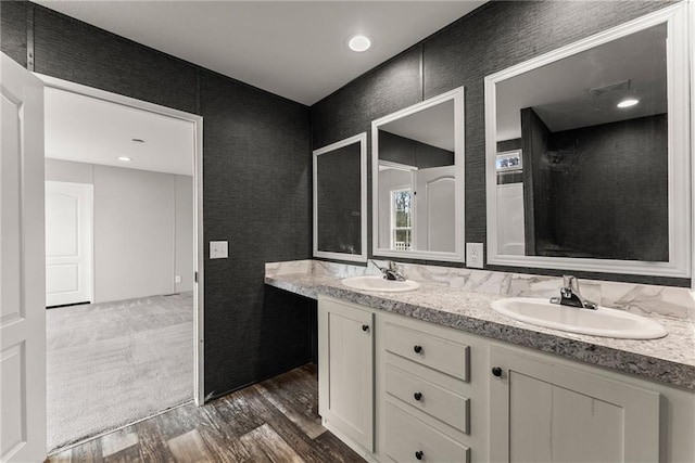 bathroom featuring vanity and wood-type flooring