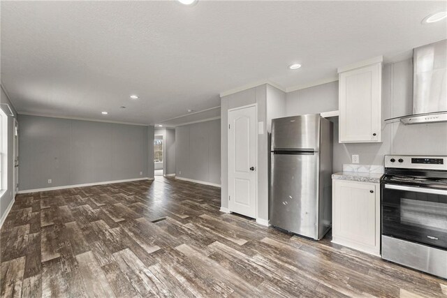 kitchen with white cabinetry, sink, appliances with stainless steel finishes, wall chimney exhaust hood, and a breakfast bar area