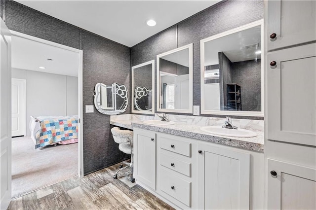 bathroom featuring hardwood / wood-style floors and vanity