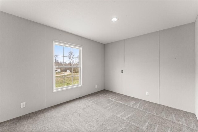 clothes washing area with washer and clothes dryer and wood-type flooring