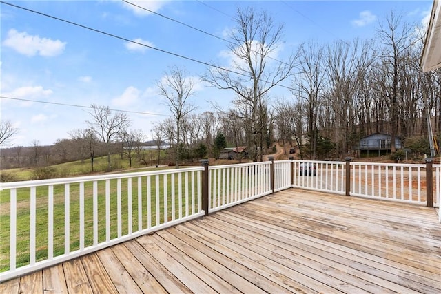 wooden terrace with a lawn