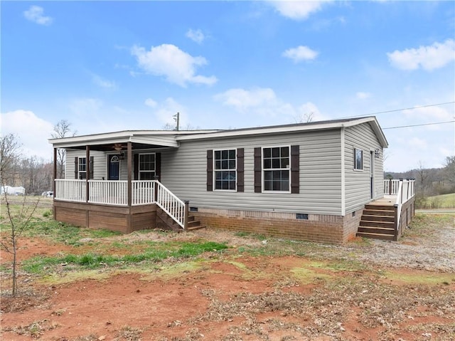 manufactured / mobile home featuring a porch