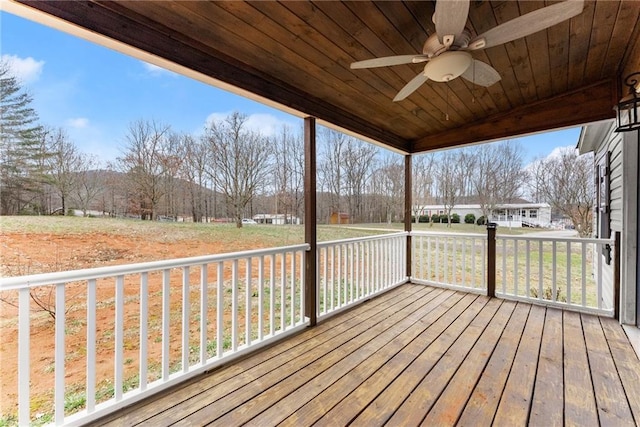 wooden deck featuring ceiling fan