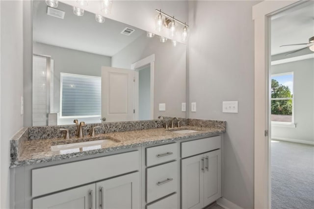 full bathroom with visible vents, a sink, and ceiling fan