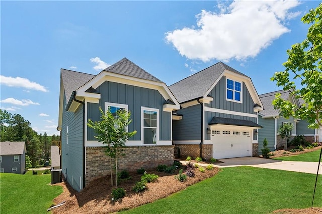 craftsman-style house with brick siding, board and batten siding, cooling unit, driveway, and a front lawn