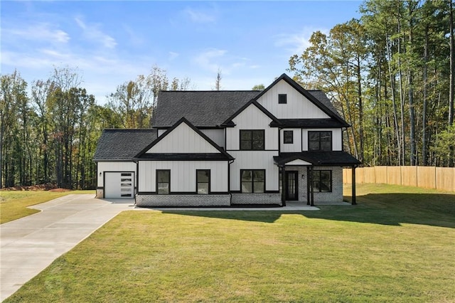 modern farmhouse style home with a front yard and a garage