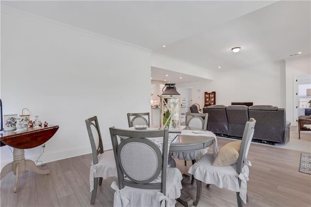 dining room featuring baseboards and wood finished floors