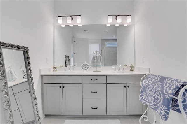 bathroom with double vanity and a sink
