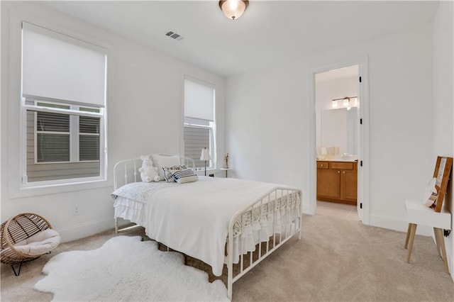 bedroom featuring baseboards, multiple windows, light carpet, and visible vents