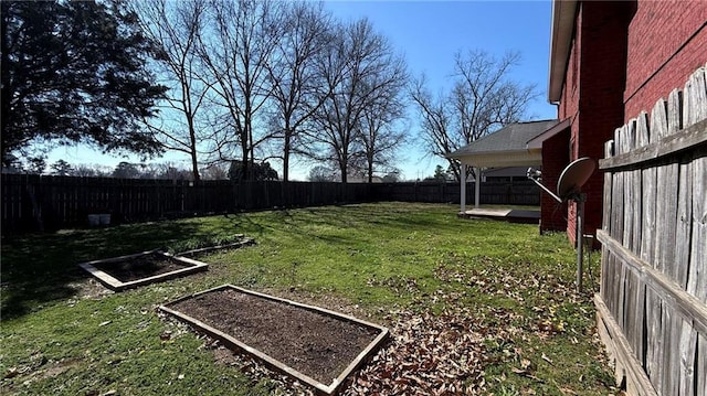 view of yard featuring a patio area and a fenced backyard