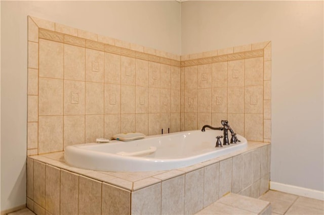 full bath with baseboards, a bath, and tile patterned floors