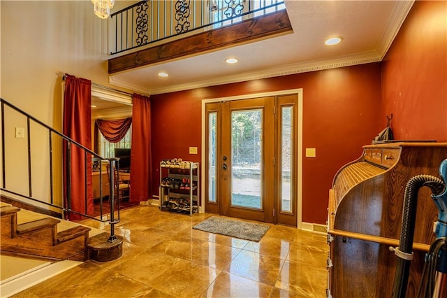 foyer with recessed lighting, a high ceiling, baseboards, stairs, and ornamental molding