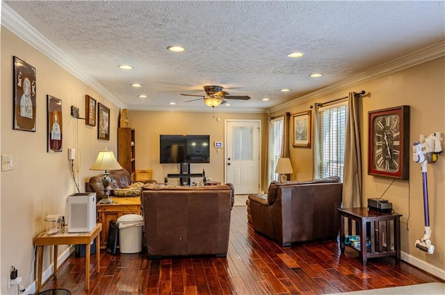 living area with a textured ceiling, recessed lighting, wood finished floors, baseboards, and crown molding