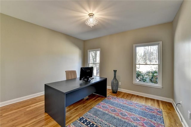 office area featuring baseboards and light wood-style floors