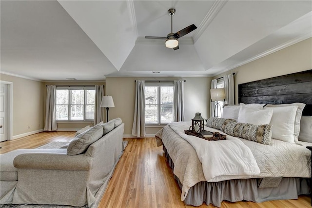 bedroom featuring baseboards, a ceiling fan, light wood-style floors, and ornamental molding