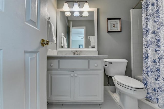 full bathroom featuring tile patterned floors, baseboards, toilet, and vanity