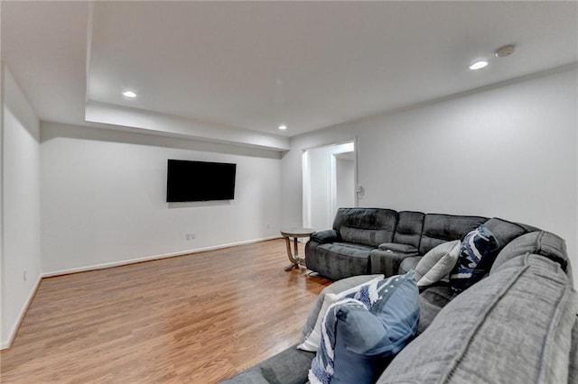 living room with recessed lighting, wood finished floors, and baseboards