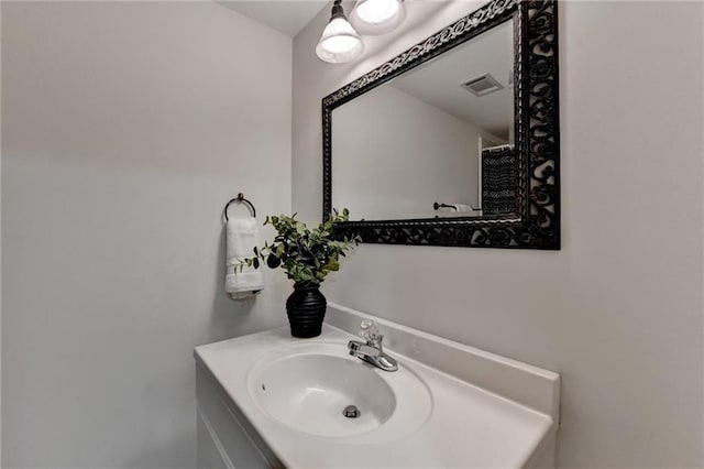 bathroom with visible vents and vanity