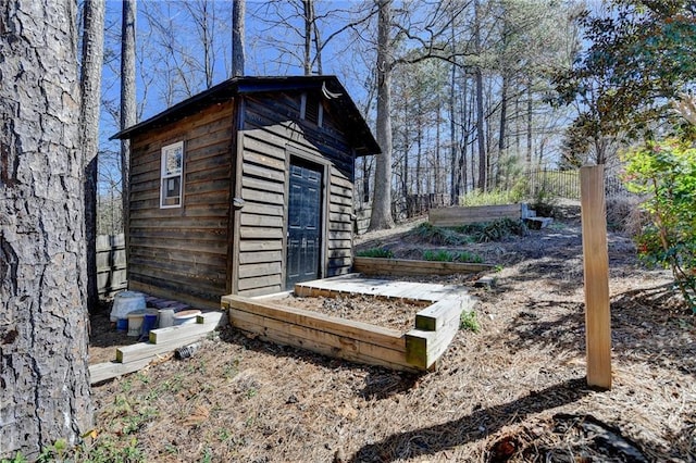 view of side of home with an outbuilding