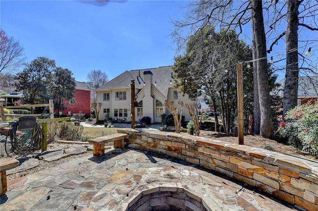 view of patio with an outdoor fire pit