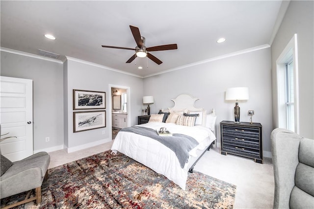 bedroom featuring ceiling fan, ornamental molding, ensuite bathroom, and carpet flooring