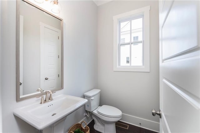 bathroom with sink and toilet